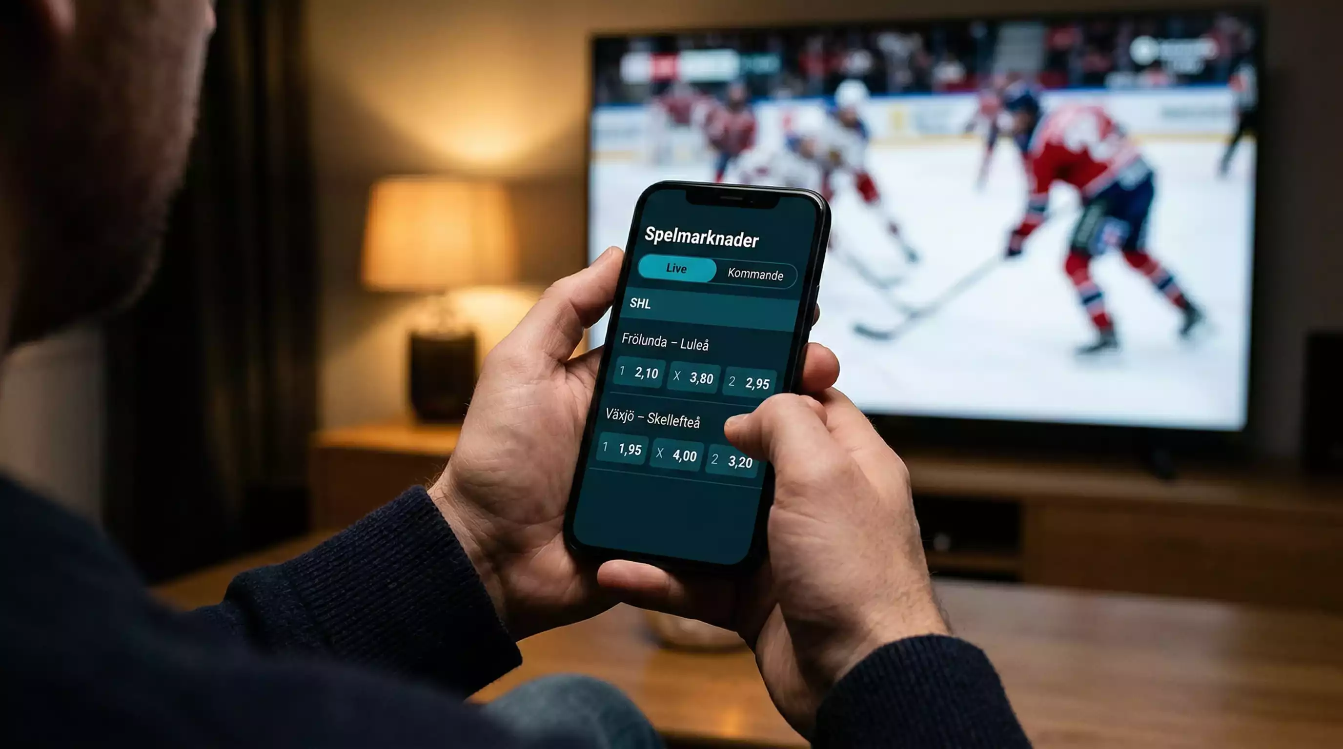 Ishockey spelmarknader med odds på en skärm bredvid en hockeyrink